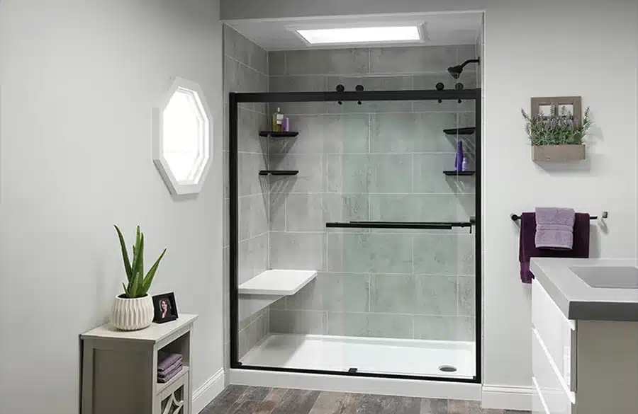 Shower bench in a modern bathroom remodeled by Earl's Plumbing in Lubbock, TX